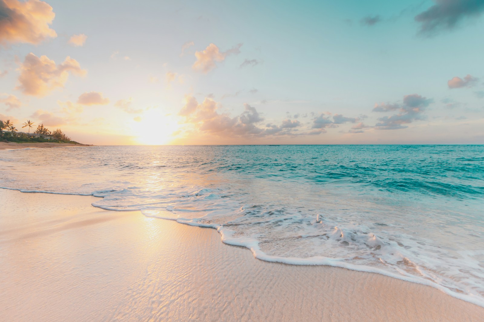 Soft daylight over a quiet beach and turquoise sea